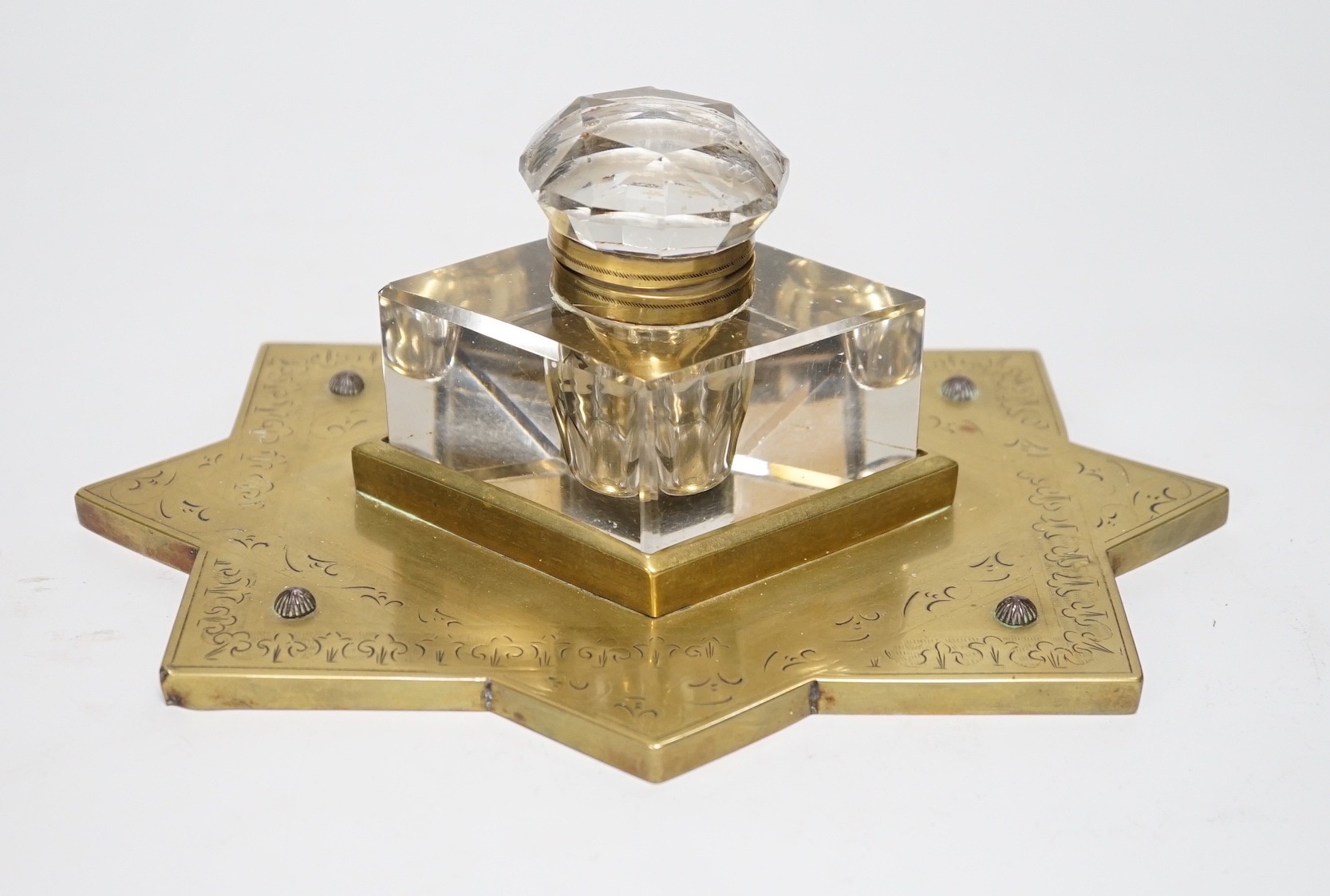 A Victorian brass mounted glass inkwell. 24cm wide